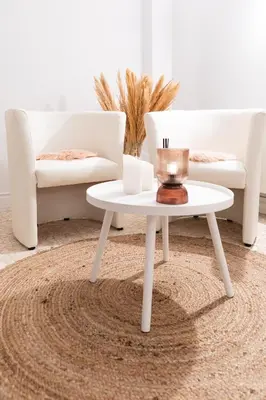 a living room with a white coffee table and two chairs at Esplanada Studios in Genk