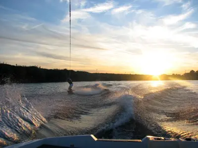 a person water skiing on a boat in the water at Vakantiehuis Aen de Roderburgh in Maaseik