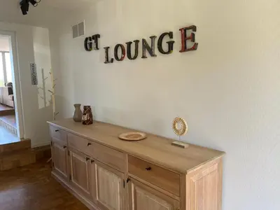 a room with a wooden cabinet with the word dance on the wall at GT Lounge in Heusden - Zolder