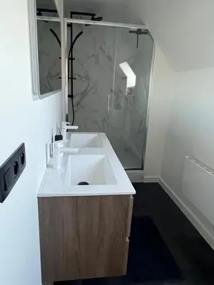 a bathroom with a white sink and a shower at GT Lounge in Heusden - Zolder