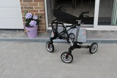 a black scooter parked in front of a house at Éco Gîtes Aubelrando & villa-bocage in Aubel