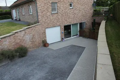 a driveway in front of a brick building at Éco Gîtes Aubelrando & villa-bocage in Aubel