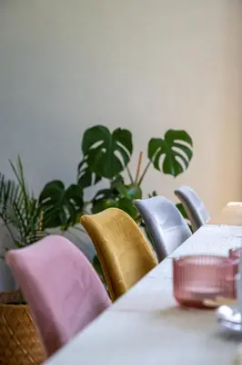 a conference room with a table and chairs and plants at De Sjieper in Lanaken