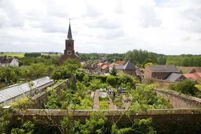 a view of a village with a church at B&B De Henehoeve in Heks