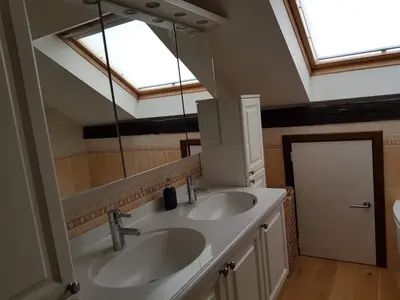 a bathroom with two sinks and a large mirror at Espace Douffet - Un havre de paix en pleine ville in Liège