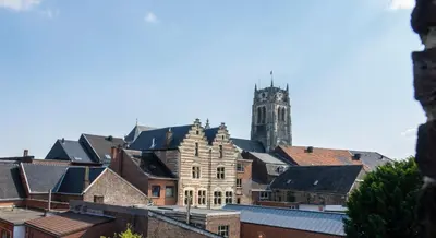 a view of a city with a clock tower at B&B Gaudium XII in Tongeren