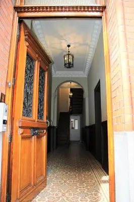 an open door to a hallway with a chandelier at B&B Gaudium XII in Tongeren
