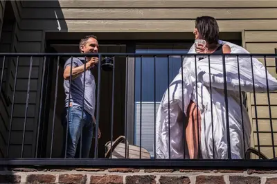 a man and a woman standing on a balcony at Time-Out Zussen in Riemst