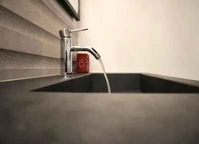 a kitchen sink with a water faucet at Time-Out Zussen in Riemst