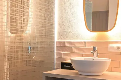 a bathroom with a sink and a mirror at Time-Out Zussen in Riemst
