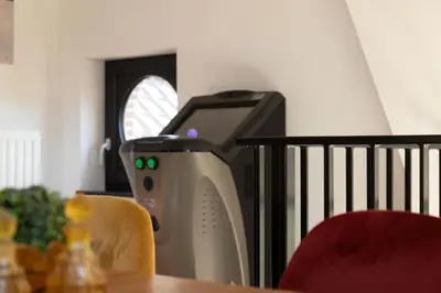 a computer printer sitting next to a table at Time-Out Zussen in Riemst