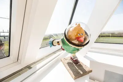 a fire hydrant sitting on a window sill at Logement insolite La tour de Larbuisson in Herve