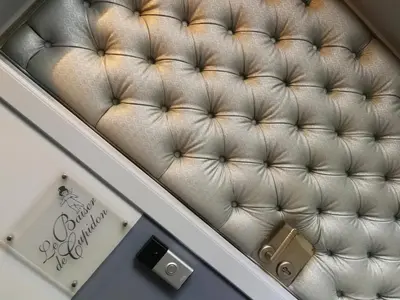 an overhead view of a white leather couch at Baiser de Cupidon in Verviers