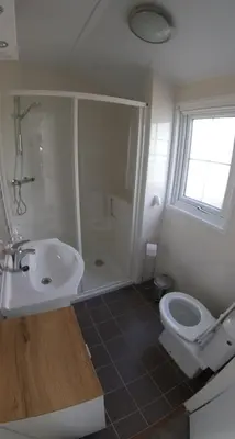 a bathroom with a sink and a toilet at Chalet 11 - Bergzicht Teuven in Teuven