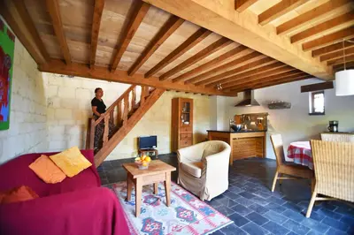 a person standing on the stairs in a living room at De Zwarte Stok in Riemst