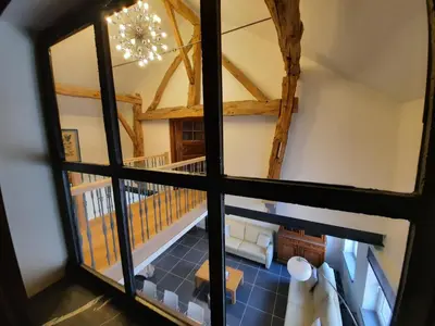 an overhead view of the living room from the attic at Het Stalhuys in Riemst