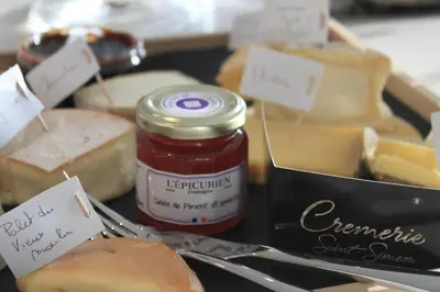 a tray of cheese and jam and a box of cheese and a jar of butter at B&B Atuatuca in Tongeren
