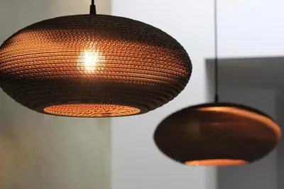 two brown lights hanging from a wall at B&B Atuatuca in Tongeren