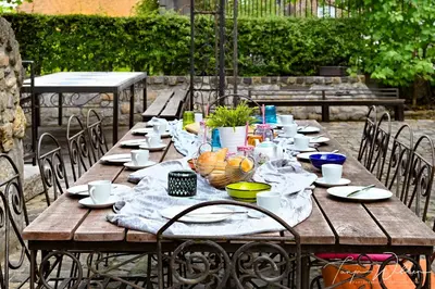 a wooden table with plates of food on it at Landhaus Lontzen in Lontzen