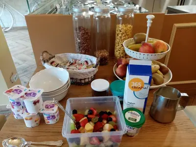 a table topped with bowls of fruit and other food at Logies Mario in Tongeren