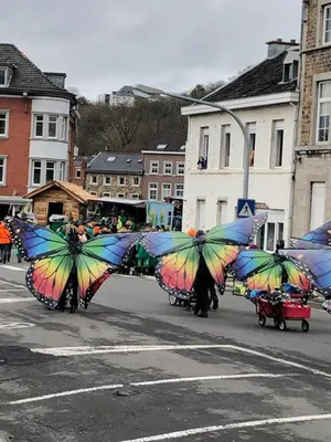 a group of people holding colorful umbrellas on a street at VIP 67 in Eupen