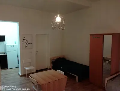 a living room with a couch and a table at Logement Régence in Liège