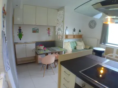 a doll house kitchen with a desk and a table at Liège centre 6 rue montagne sainte Walburge, 4000 Liège, pour 2 pers à 3 minutes de la gare st Lambert in Liège