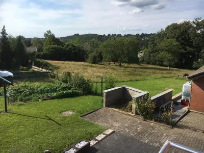 a garden with a view of a field at Chalet M in Eupen