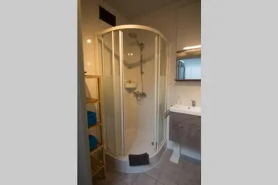a bathroom with a shower and a sink at Villa Domus XIX in Tongeren