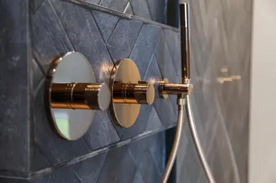 a bathroom with two mirrors on a wall at Bed & Breakfast Nummer5 in Heusden - Zolder