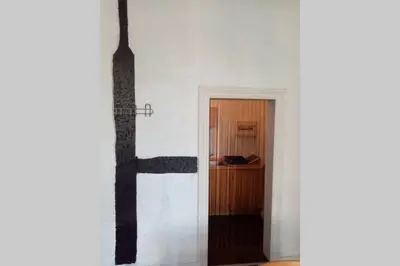a hallway with a door leading to a room at Studio donceel in Liège
