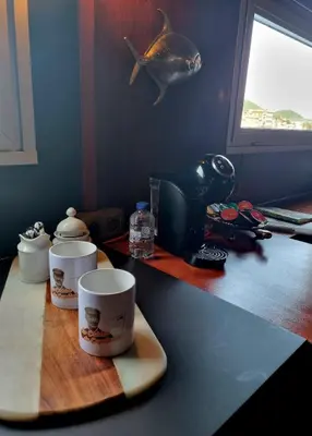 a counter with two coffee cups on a table at La Cabine du Capitaine in Liège