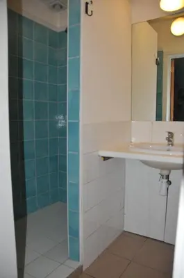 a bathroom with a sink and a mirror at La Source du Broly in Soumagne