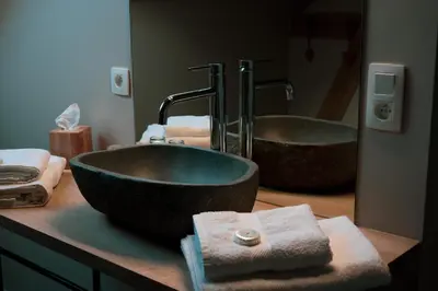 a bathroom with two sinks and a large bowl sink at Un air de bourlingueurs in Pepinster