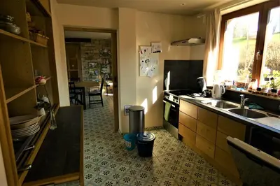 a kitchen with a sink and a stove at Un air de bourlingueurs in Pepinster