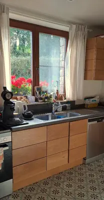 a kitchen with a sink and a window at Un air de bourlingueurs in Pepinster