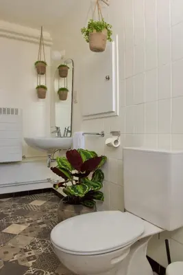a bathroom with a white toilet and a sink at Vakantiewoning Oudsbergen in Oudsbergen