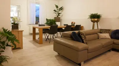 a living room with a couch and a table at Vakantiewoning Oudsbergen in Oudsbergen