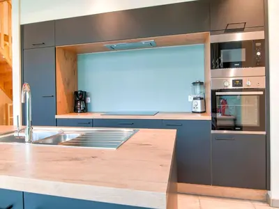 a kitchen with a sink and a counter top at Bocholt Family Home, Bocholt in Bocholt