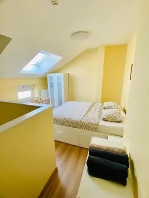 a bedroom with a bed in a room at Les gîtes du Broukay - Alouette in Bassenge