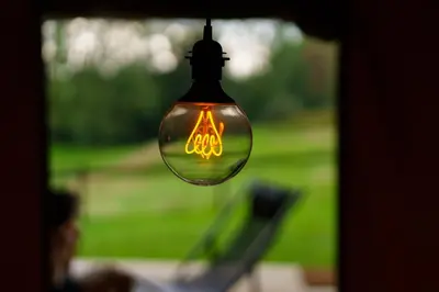 a light bulb with a lit up sign on it at Le Relais d'Artagnan - relais équestre in Mortier