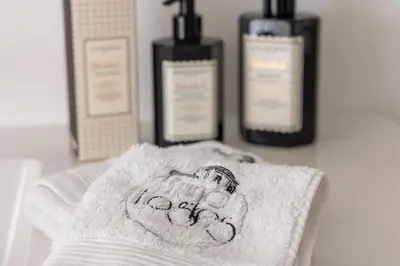 a towel with a picture of a hand on it at Luna Logies in Lanaken