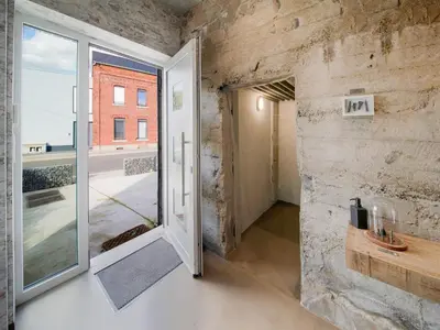 an open door in a room with a brick wall at Holiday home in Vise Richelle near town in Richelle