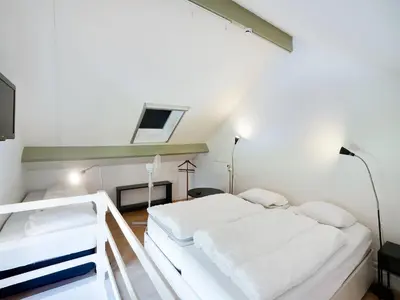 a bedroom with a white bed in a room at Voeren Mansion with Garden in Voeren