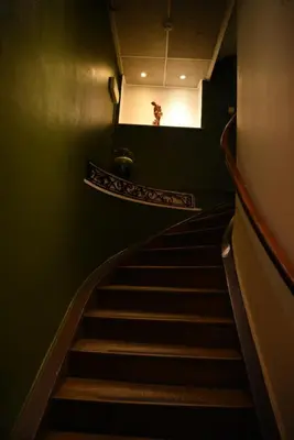 a staircase in a building with a light at the top at Le Piercot in Liège