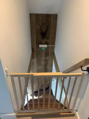 a view of a staircase with a painting of a stag on the wall at Maas Lodge in Maaseik