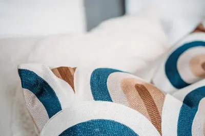 a close up of a couch with blue and white stripes at B&B Maison Mairie Hasselt in Hasselt