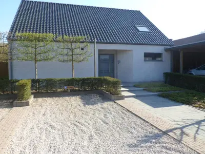 a house with a gravel driveway in front of it at Bosrand81 in Hechtel