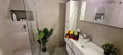 a bathroom with a shower and a sink and a toilet at Les Croisettes 88, design loft XXL with amazing vue for peaceful stay in Trooz