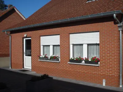 a brick house with three windows with flower boxes at Elegant & Peaceful Holiday Retreat in Peer in Peer